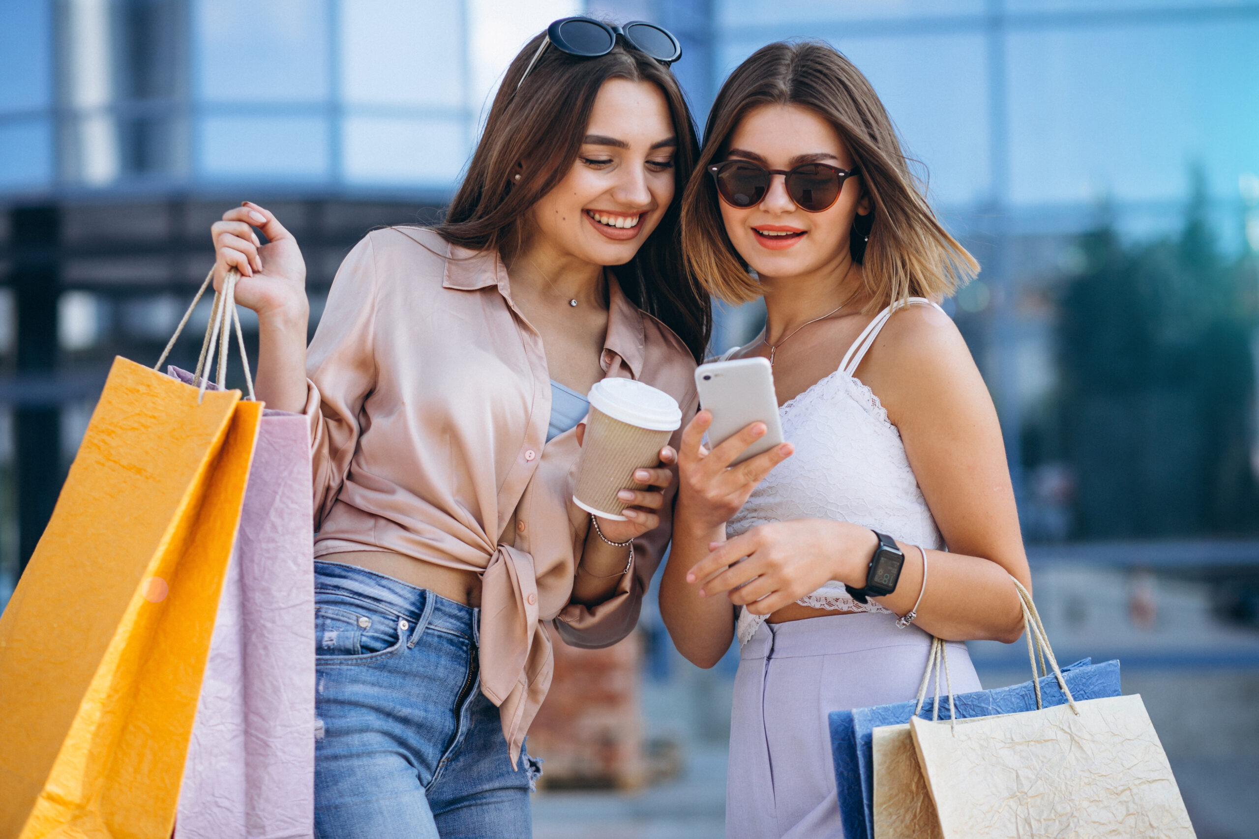 Two beautiful women shopping in town